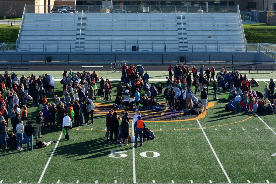 Students huddle during the fire drill. The drill was conducted during 40 degree weather with 25 miles-per-hour winds. 