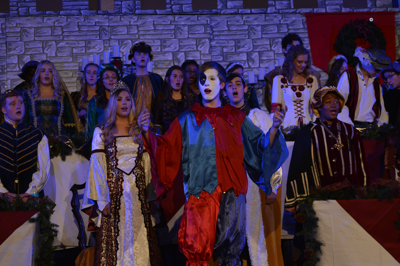 The seniors who make up the royal court perform at madrigal. Madrigal was held at The Bridge on Nov. 29 and 30.