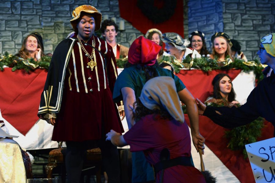 Two students playing the spite sprite and diet sprite yell at Tahj Neely,18, who plays the evil stepfather. Madrigal was held at The Bridge on Nov. 29 and 30. 