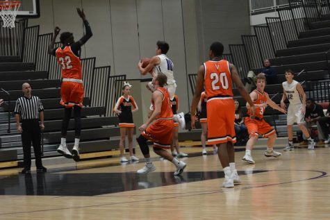 Boys’ varsity basketball wins first home game