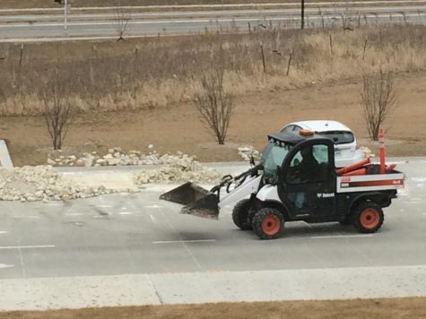 Landscaping rocks finally moved from parking lot