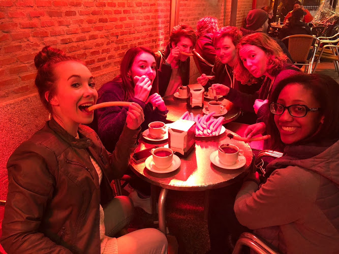 Amber Altman, Bianca Leewright, Katherine Srail, Mackenzie Stanley, Grace Saliers and Kennedy Stone are seated, basking in the heated lamps on a cold night. “We found this famous churros and chocolate place,” Mackenzie Stanley ‘19 said. “The hot chocolate there is literally just melted chocolate, instead of milk, and we got these huge plates of churros that are stacked to the brim.”
