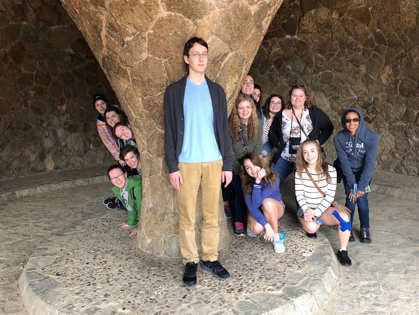 Jake Atterberg ‘19 stands in front of a column in  Park Güell, while the rest of the group stands around him. “ I felt like me being with only girls on the trip wasn’t bad at all, however I was used as the butt of a large number of jokes because I was the only guy,” Atterberg said. 