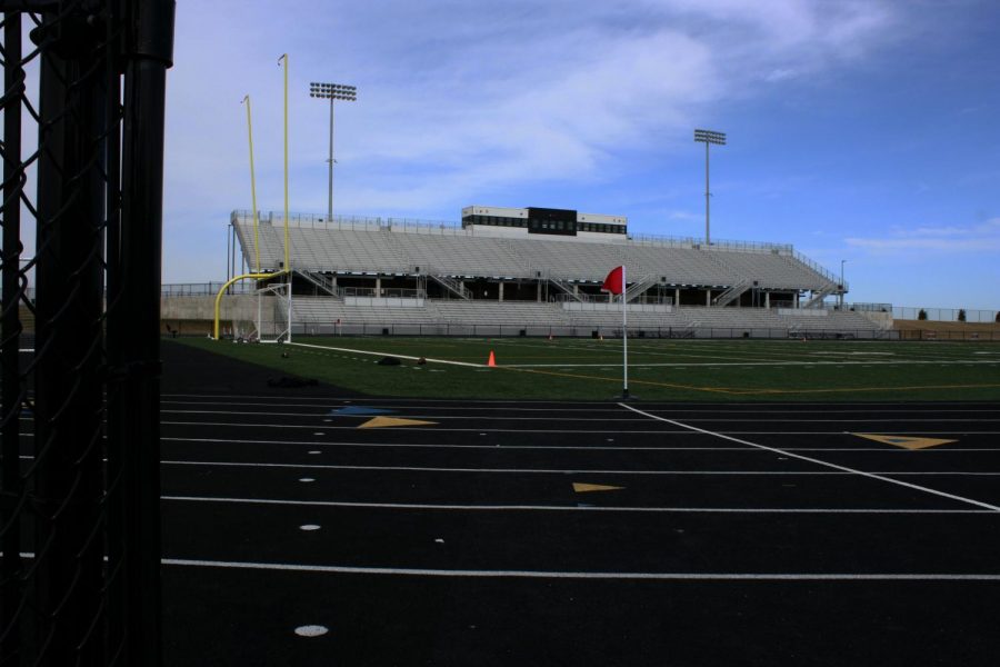 A view from the side of the bleachers, looking onto the football field. 