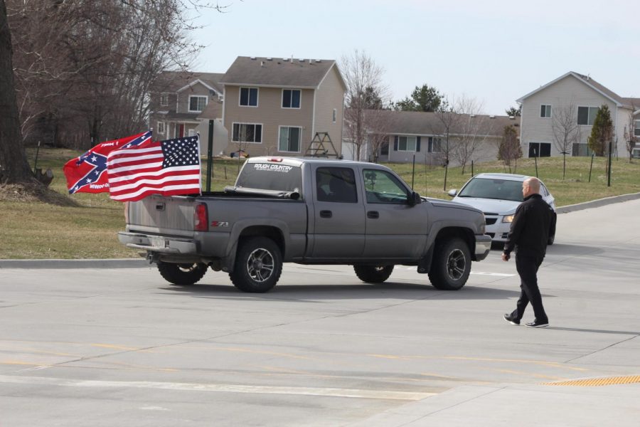Principal Woods approaches a vehicle flying a confederate flag in the parking lot. Woods approached the vehicle during the April 20 walkout. 