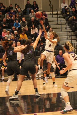 Girls basketball win, boys basketball lose by 15