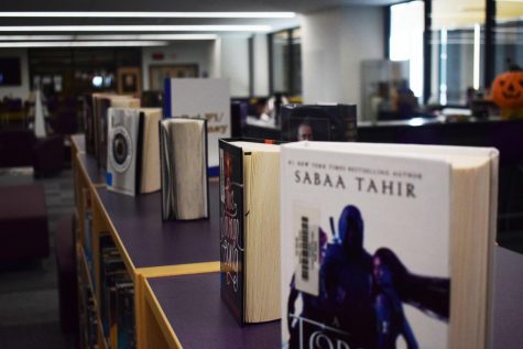 Johnston School Library Having there common day of checking out books to students