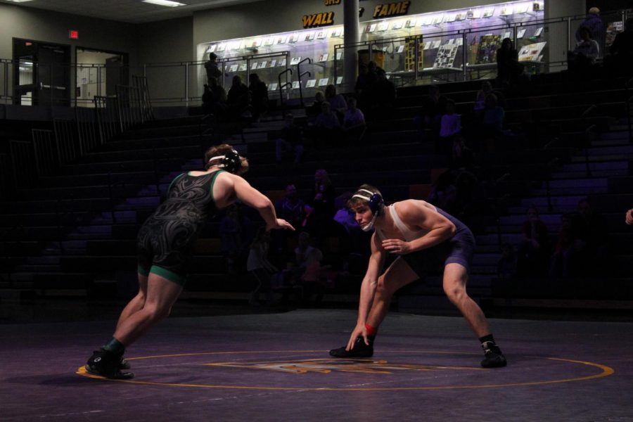 Tyler Christensen 19 and his opponent, North-Hoovers Dalton Davis, face off in neutral position. Christensen went on to win the match.  