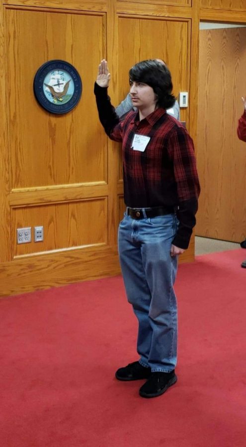 Connor Tomlinson taking the oath to swear into the USMC at Camp Dodge on Jan. 14., 2019