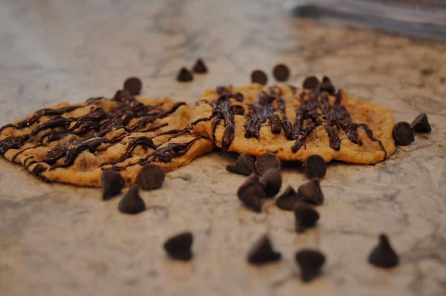 Drizzling chocolate on top of chocolate chip cookies is never a bad idea.