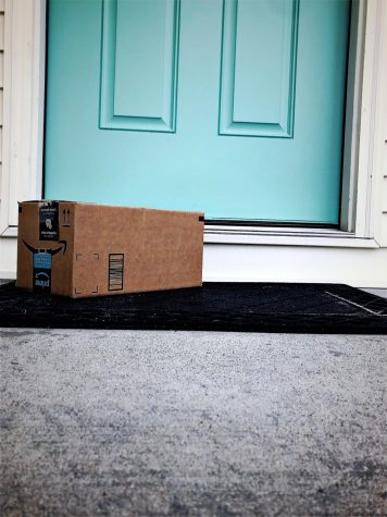 An Amazon package sits on the front step.