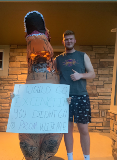 Vinnie Aspengren 19 with his date, Macie Gay 19. Gay dressed up as a dinosaur and asked Aspengren to prom.