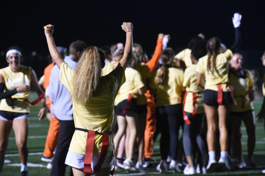 After completing the final play of the game, Maya McDermott ‘20 looks on at her team before she joins their huddle to celebrate their back-to-back powderpuff win.