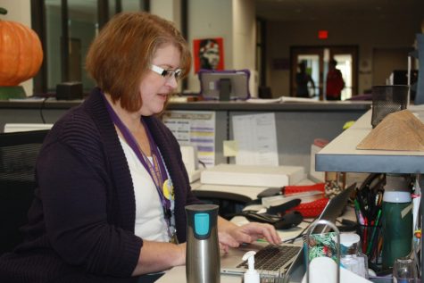 Ruth Thoreson sits at her computer in the library, working on a project.