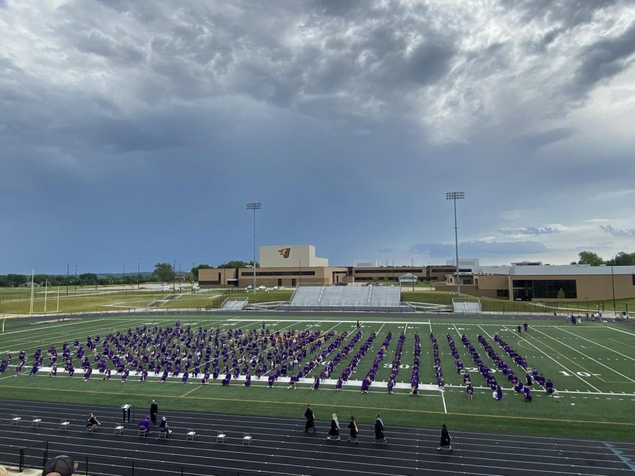 Students take their seats as the commencement ceremony began on June 27 at the stadium. 