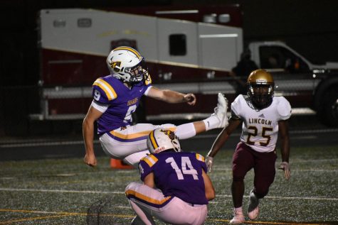 Blake Tubbs '21 scores an extra point for the Dragons.