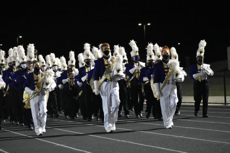 JHSVMB Drum Majors lead the way as the band troops the stands.