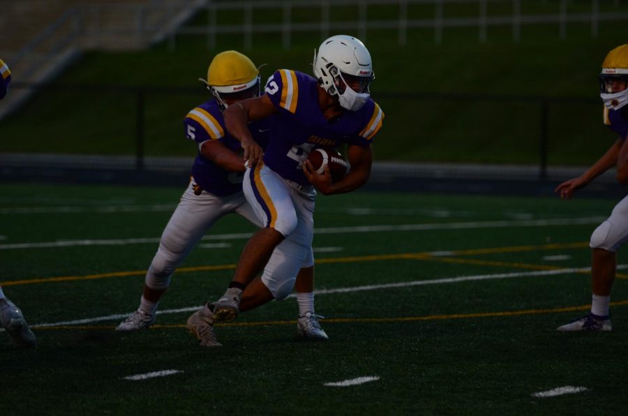 Christian Boivin 21 carries the ball during a preseason scrimmage on Sep. 21.