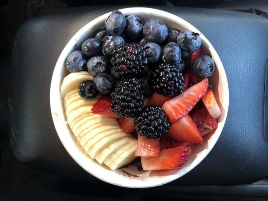 This is an acai bowl from Big Acai. It has the acai base and is topped with granola, peanut butter, banana and mixed berries. Customers have the ability to choose what kind of base and toppings they want in their bowl.