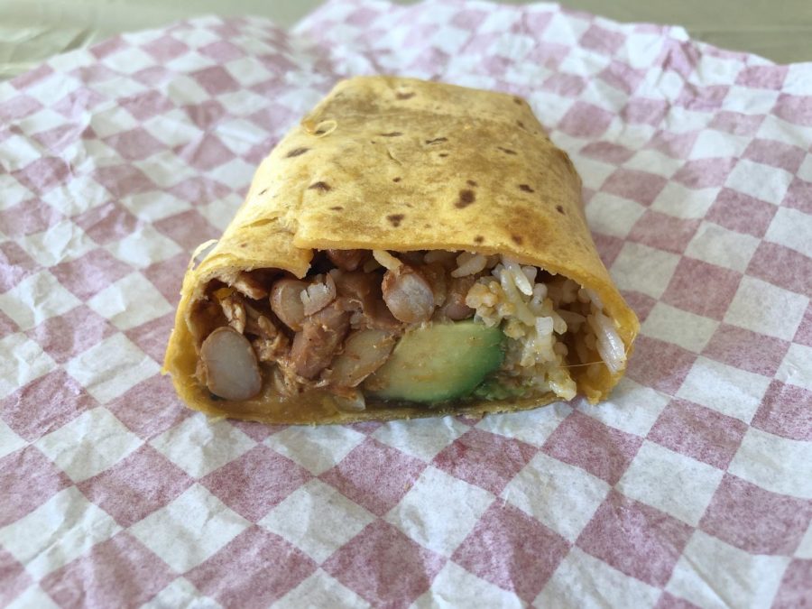 This the chicken burrito that comes with chicken, avocado, beans, rice, and cheddar cheese.