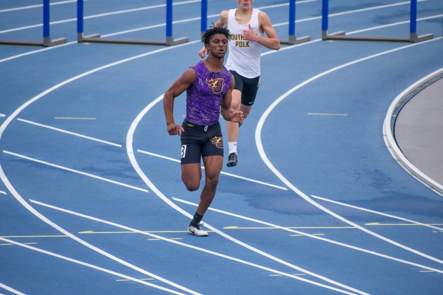 Donnie Henderson 22 running in the last 100 meter stride of the 400 meter hurdle race. Ending with a time of 1:03.29.