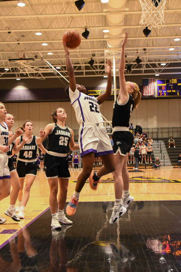 Aaliyah Riley 24 scores a lay up against Ankeny Centennial 12/14/21. 