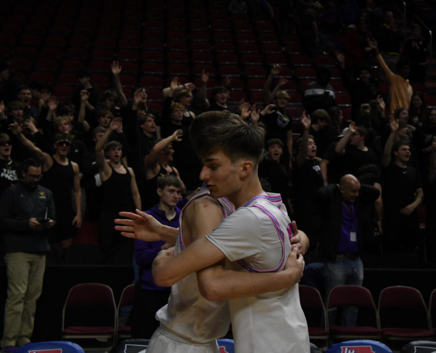 Nathan Rusich 23 hugs a teammate after a semifinal win over Cedar Rapids Prairie.