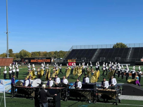 The band marches on a clear morning at Valley High Schools stadium. 