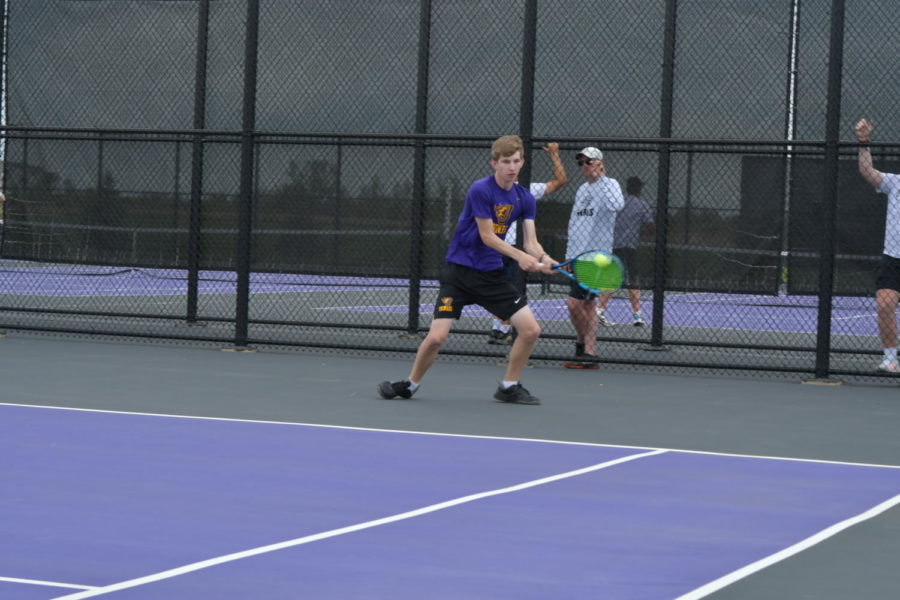 Mitch Driscoll uses a forehand shot to return the ball during Boys Substate