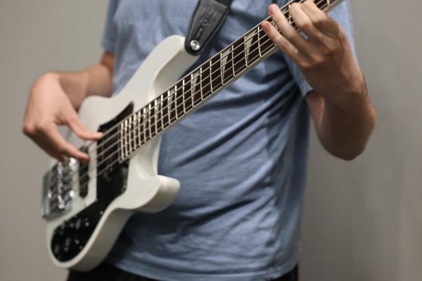 Zedric McCorkel playing on his electric guitar during Jazz Syndicate rehearsal.