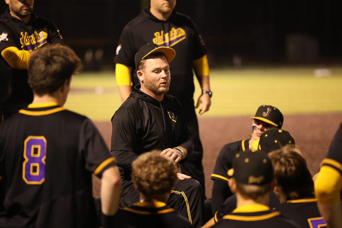 Coach Barta talks with his team following a baseball game. 